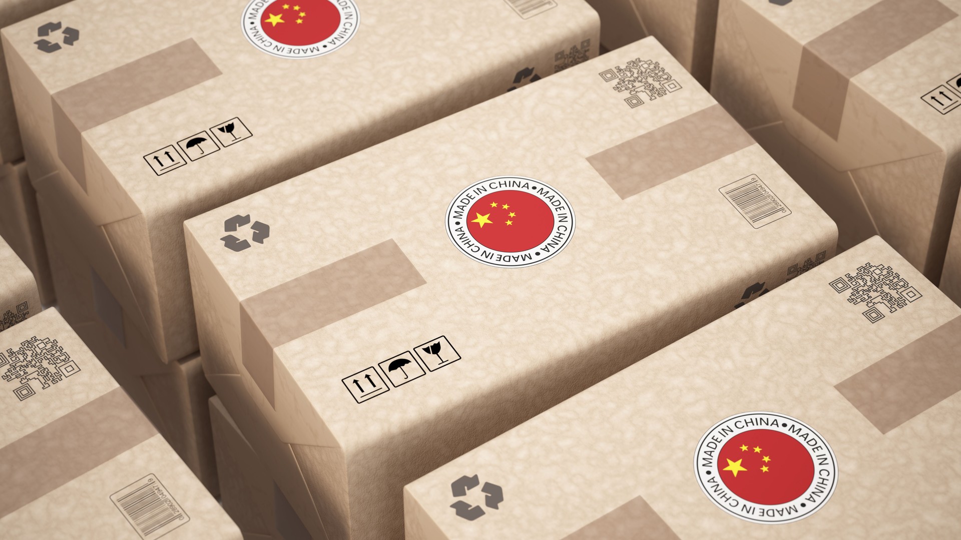 Shipping boxes marked with Chinese symbols stacked in a warehouse for distribution and delivery